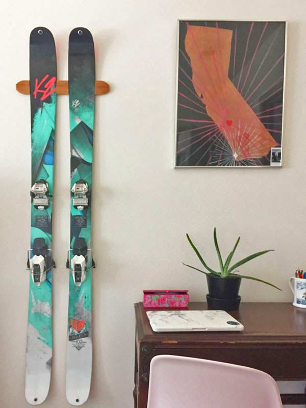 Snowboard mounted on our wall rack